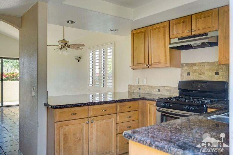 34404 Laura Way Rancho Mirage, CA 92270 - Photo 13 of 31 a kitchen with stainless steel appliances granite countertop a sink stove and refrigerator
