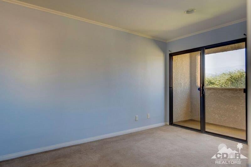 34404 Laura Way Rancho Mirage, CA 92270 - Photo 16 of 31 a view of an empty room with a window