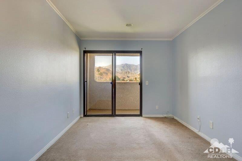 34404 Laura Way Rancho Mirage, CA 92270 - Photo 17 of 31 an empty room with windows