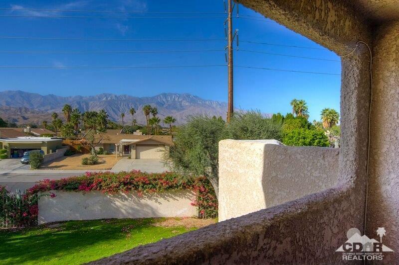 34404 Laura Way Rancho Mirage, CA 92270 - Photo 18 of 31 a view of a swimming pool with a yard and mountain view