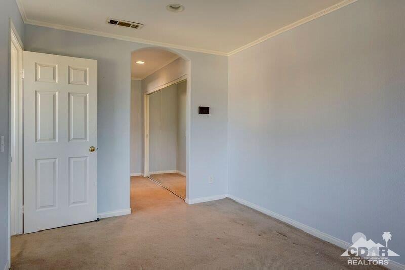 34404 Laura Way Rancho Mirage, CA 92270 - Photo 19 of 31 an empty room with windows