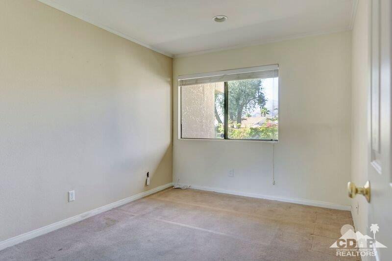 34404 Laura Way Rancho Mirage, CA 92270 - Photo 23 of 31 an empty room with windows
