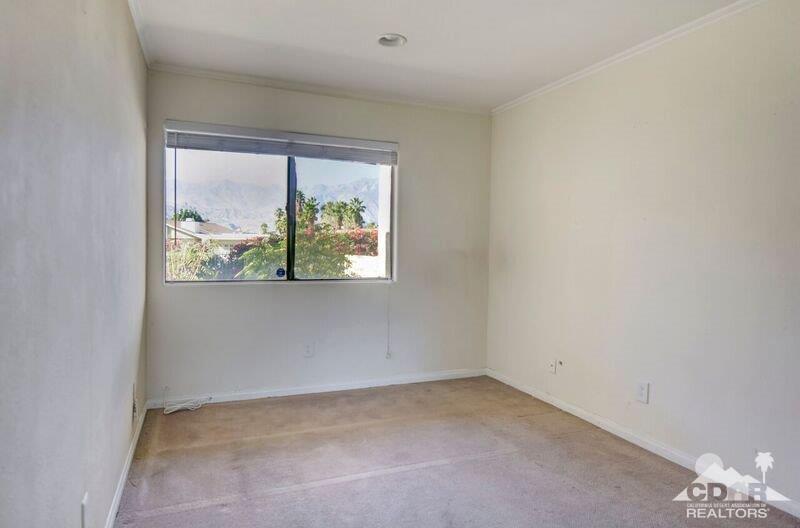 34404 Laura Way Rancho Mirage, CA 92270 - Photo 24 of 31 an empty room with a window