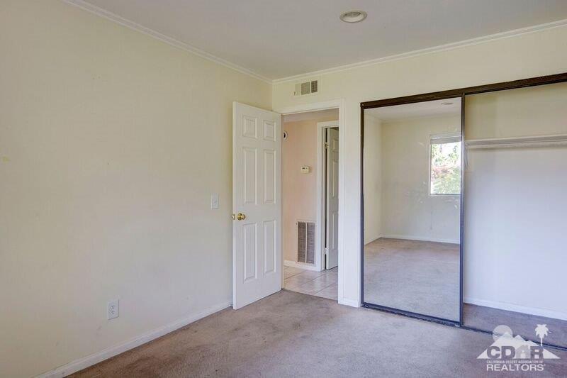 34404 Laura Way Rancho Mirage, CA 92270 - Photo 25 of 31 an empty room with mirror in closet