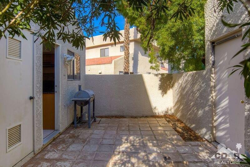 34404 Laura Way Rancho Mirage, CA 92270 - Photo 28 of 31 a view of backyard with a large tree