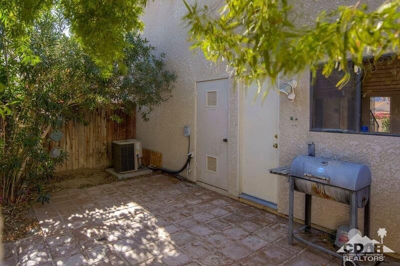 34404 Laura Way Rancho Mirage, CA 92270 - Photo 29 of 31 a backyard of a house with table and chairs