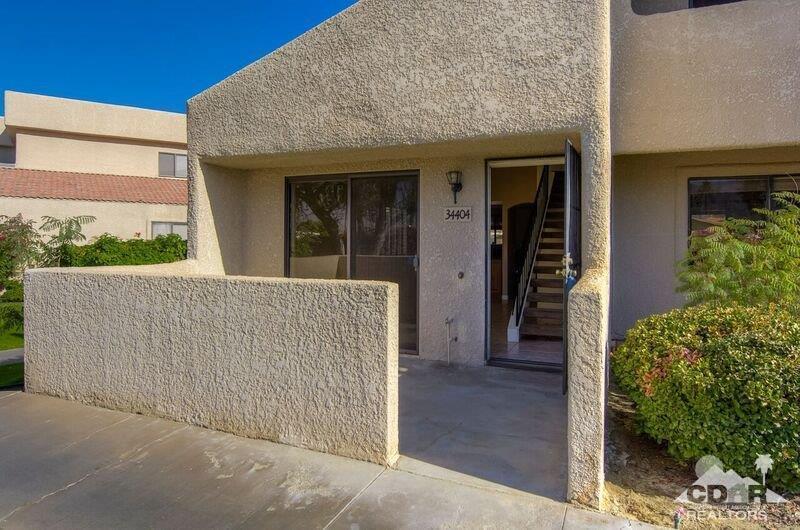 34404 Laura Way Rancho Mirage, CA 92270 - Photo 7 of 31 front view of a house with a porch