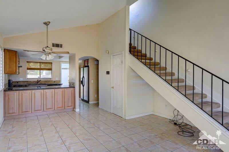 34404 Laura Way Rancho Mirage, CA 92270 - Photo 9 of 31 a view of a kitchen with a sink and a refrigerator