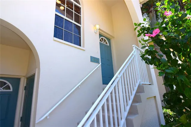 a view of stairs and flowers