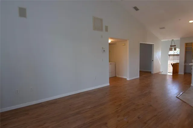 a view of a livingroom with wooden floor