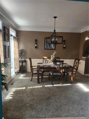 a view of a deck with wooden floor barbeque oven and backyard