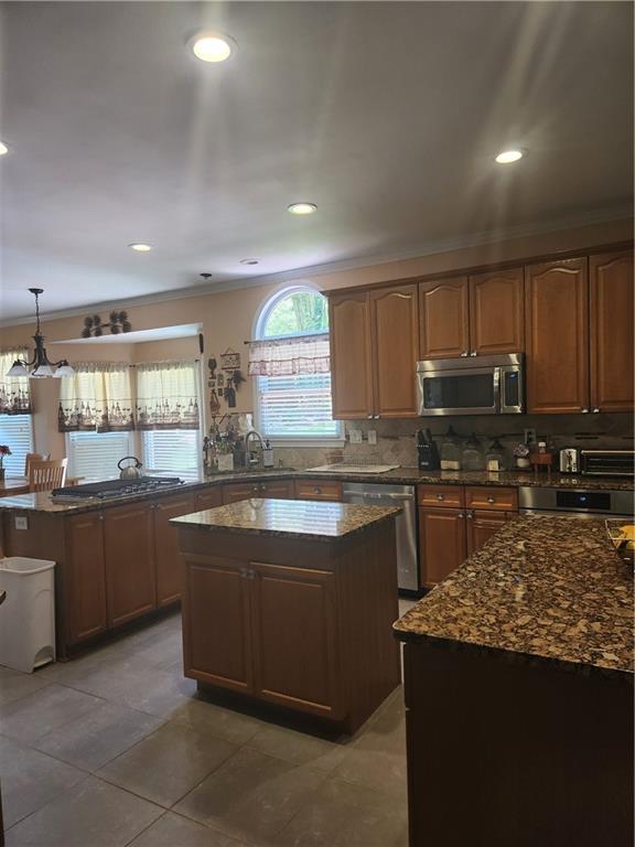 2520 Cobble Creek Lane Grayson, GA 30017 - Photo 15 of 114 a kitchen with stainless steel appliances granite countertop a stove a sink and a refrigerator