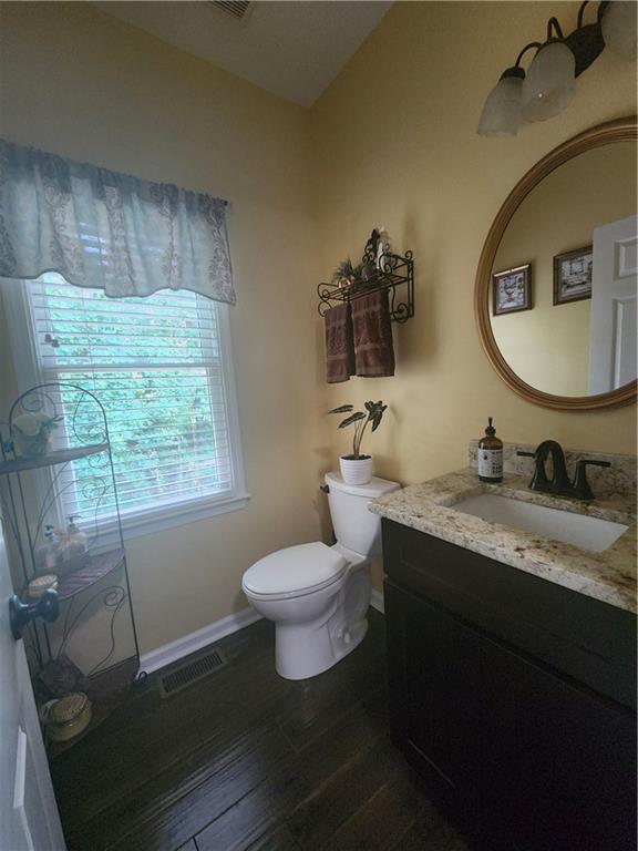 2520 Cobble Creek Lane Grayson, GA 30017 - Photo 17 of 114 a bathroom with a granite countertop toilet sink and mirror