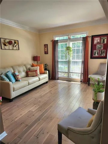 a view of a livingroom with wooden floor