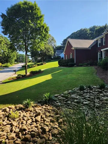 a kitchen with granite countertop a sink and cabinets