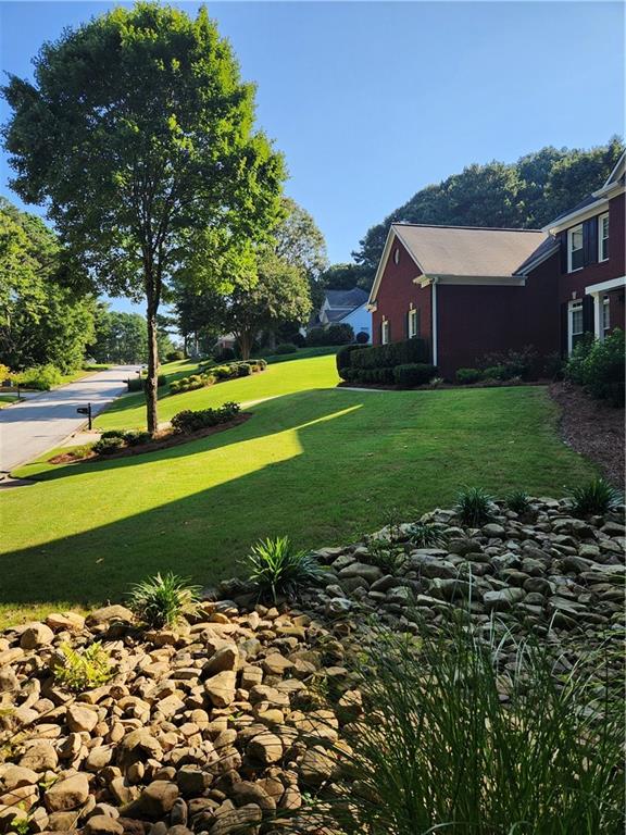 2520 Cobble Creek Lane Grayson, GA 30017 - Photo 28 of 114 a view of a house with a big yard