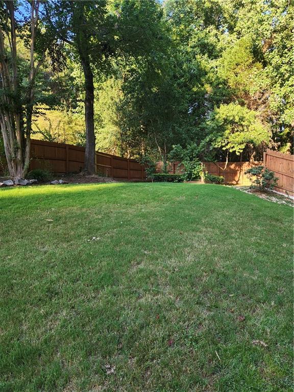 2520 Cobble Creek Lane Grayson, GA 30017 - Photo 34 of 114 a view of a yard with a tree