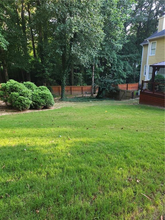 2520 Cobble Creek Lane Grayson, GA 30017 - Photo 41 of 114 a view of a backyard with a garden and trees