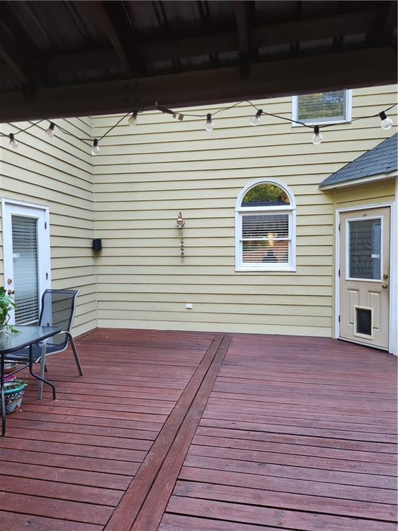 2520 Cobble Creek Lane Grayson, GA 30017 - Photo 45 of 114 a view of a deck with a table and chairs