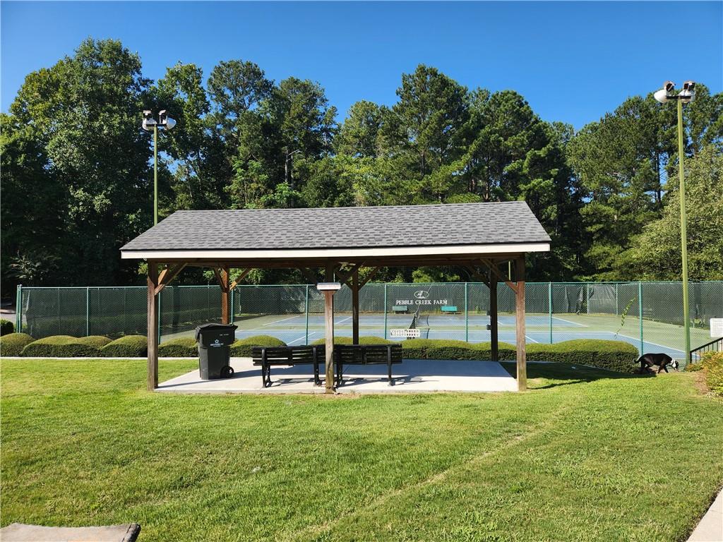 2520 Cobble Creek Lane Grayson, GA 30017 - Photo 6 of 114 a backyard of a house with table and chairs