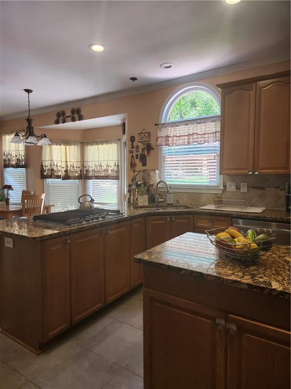 2520 Cobble Creek Lane Grayson, GA 30017 - Photo 62 of 114 a kitchen with a sink a counter top space and cabinets