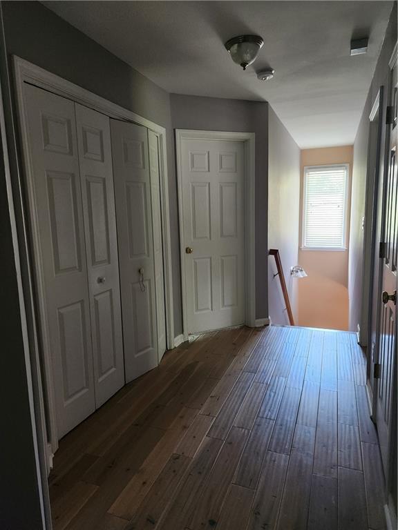 2520 Cobble Creek Lane Grayson, GA 30017 - Photo 69 of 114 a view of a hallway with wooden floor and staircase