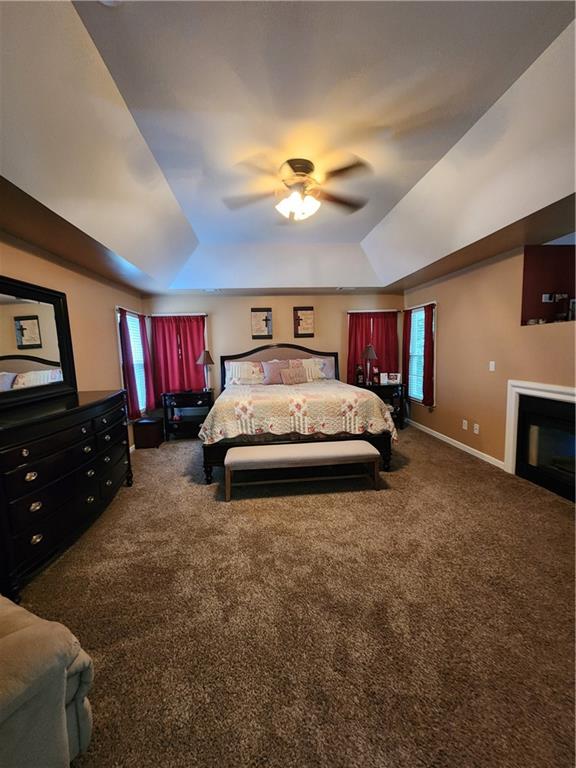 2520 Cobble Creek Lane Grayson, GA 30017 - Photo 73 of 114 a spacious bedroom with a bed and a flat screen tv