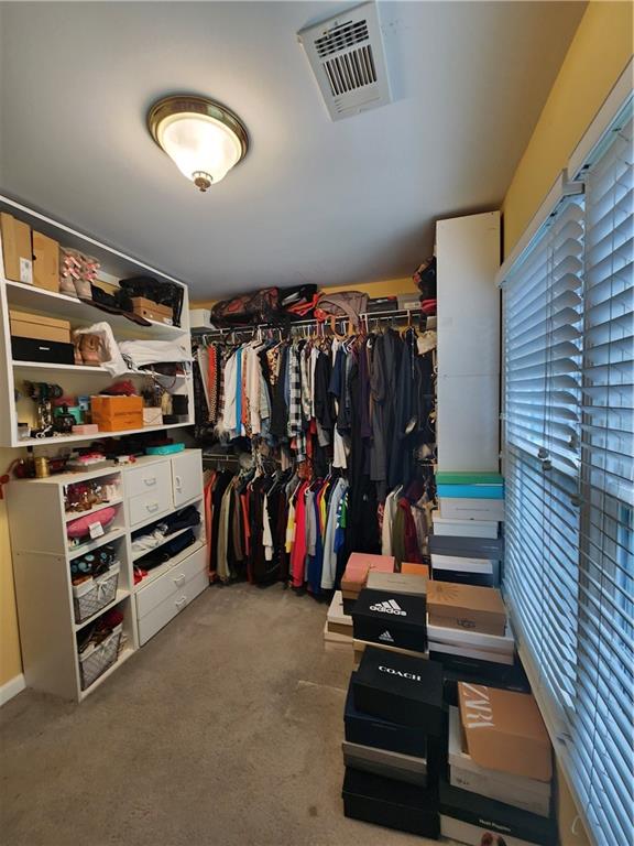 2520 Cobble Creek Lane Grayson, GA 30017 - Photo 86 of 114 a view of walk in closet with clothes and shoes