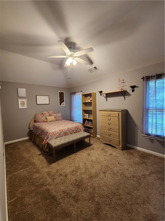 2520 Cobble Creek Lane Grayson, GA 30017 - Photo 89 of 114 a spacious bedroom with a bed and a ceiling fan