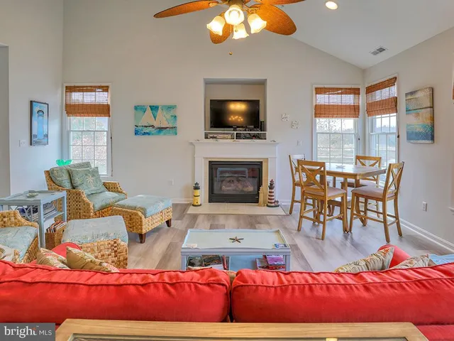 a view of a dining room with furniture wooden floor and chandelier