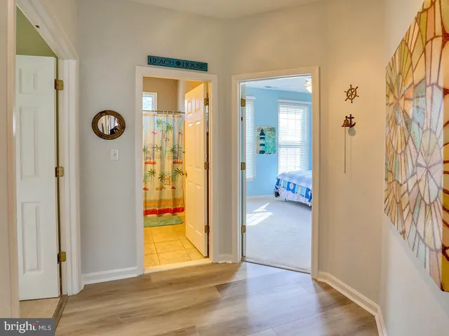 a bedroom with two beds and a window