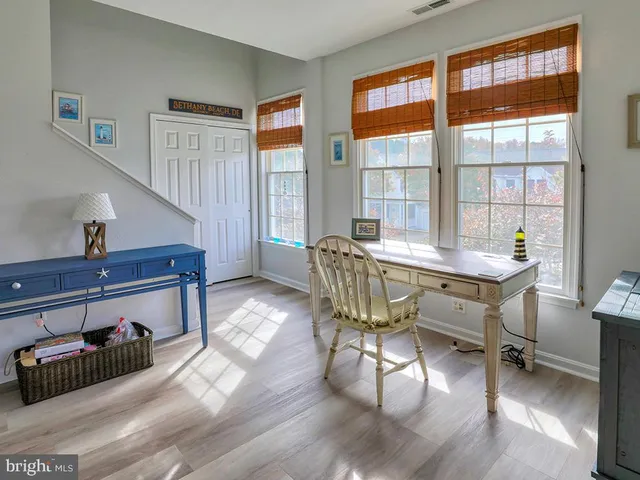 an aerial view of a house with garden space and outdoor seating