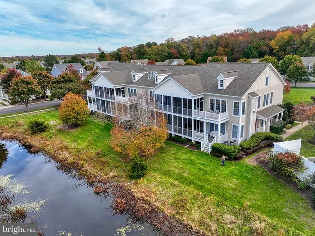 a front view of a house with outdoor seating