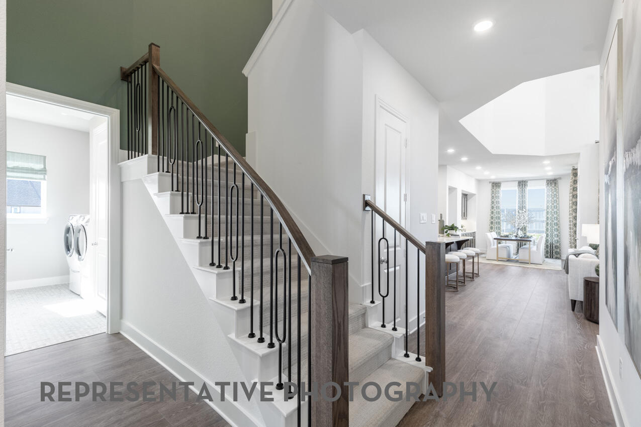 1216 Wolf Cyn Road Georgetown, TX 78628 - Photo 29 of 39 a view of entryway and hall with wooden floor