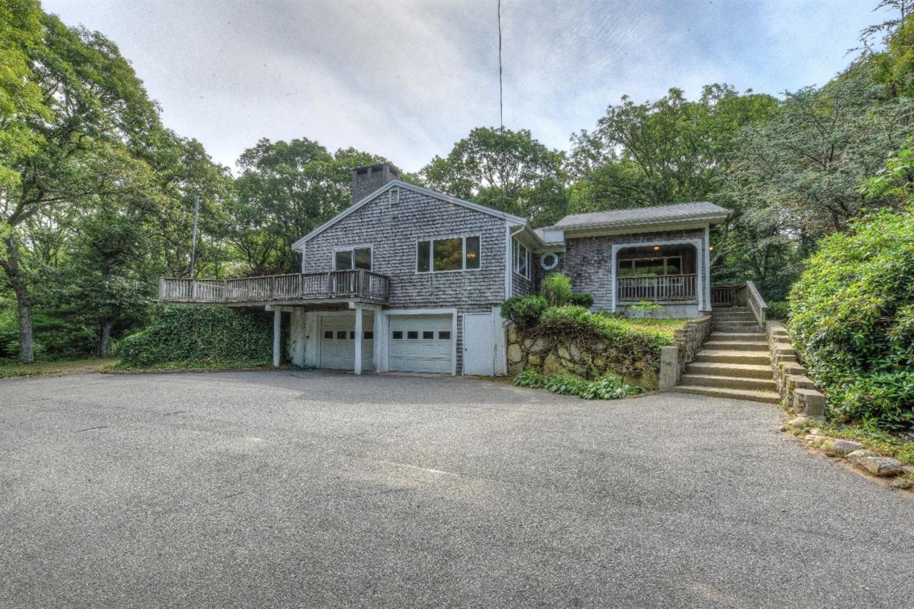 1640 Old Stage Road West Barnstable, MA 02668 - Photo 1 of 35 a view of house with a yard and potted plants