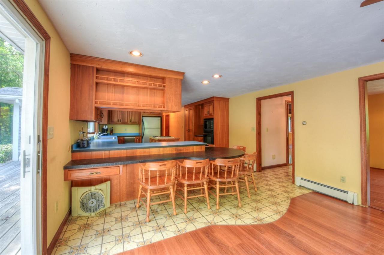 1640 Old Stage Road West Barnstable, MA 02668 - Photo 16 of 35 a dining room with furniture and wooden floor