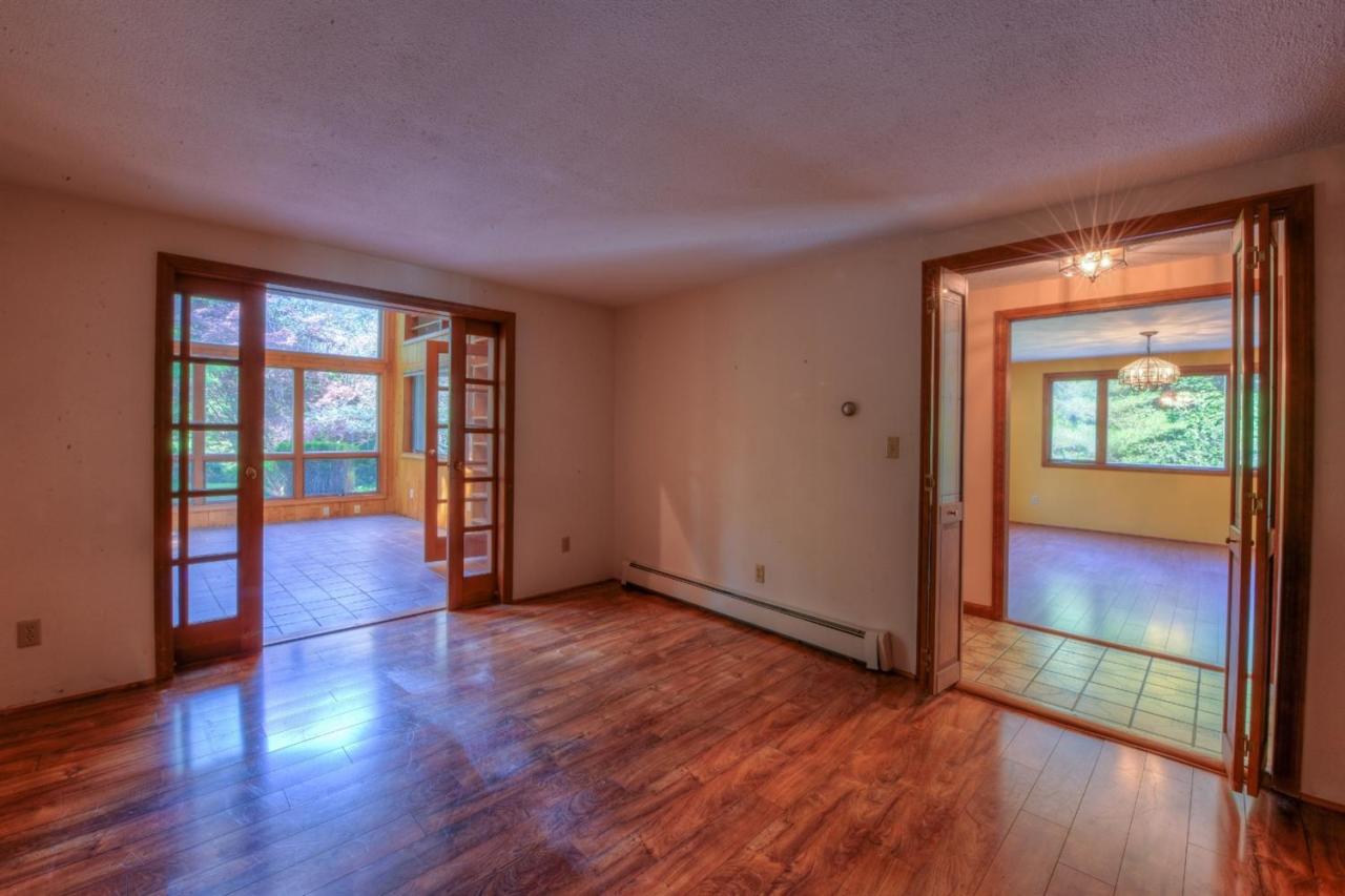 1640 Old Stage Road West Barnstable, MA 02668 - Photo 7 of 35 a view of an empty room with wooden floor and a window