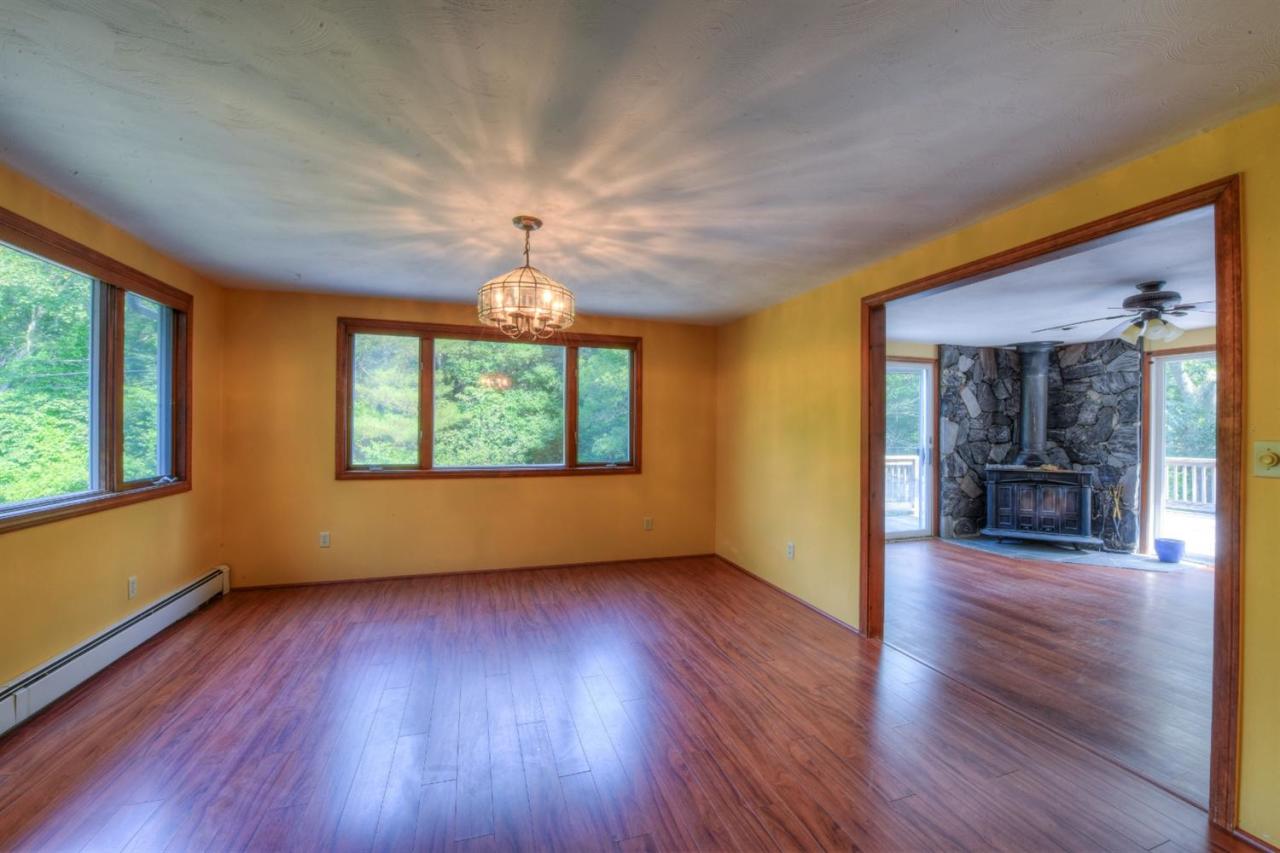 1640 Old Stage Road West Barnstable, MA 02668 - Photo 10 of 35 wooden floor in an empty room with a window