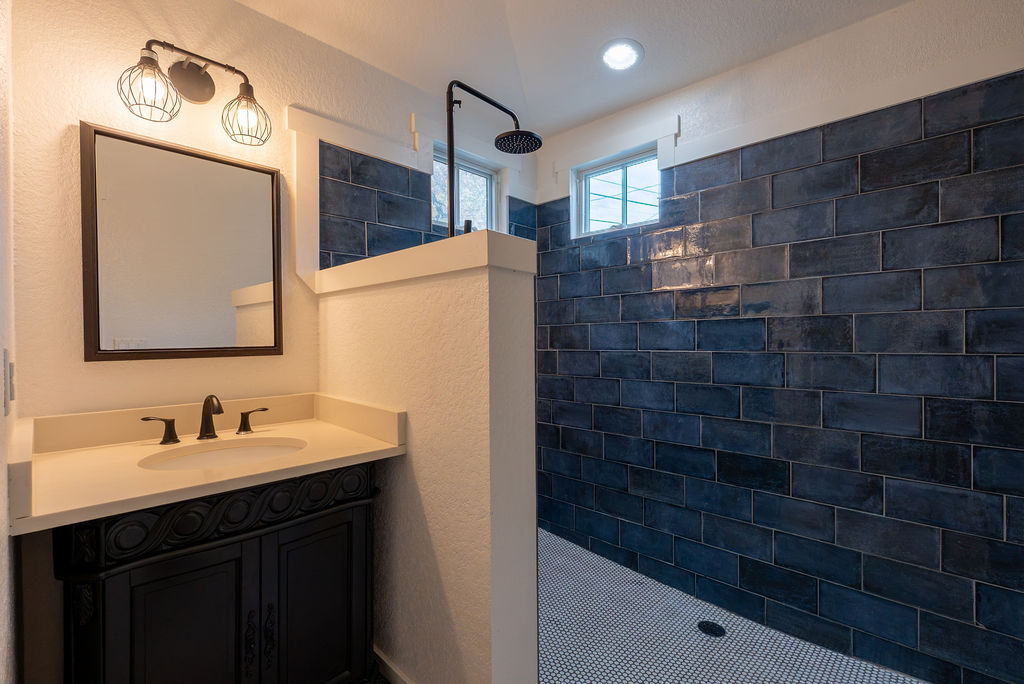 2016 Peoples Street Austin, TX 78702 - Photo 16 of 28 Bathroom featuring a walk in shower and vanity