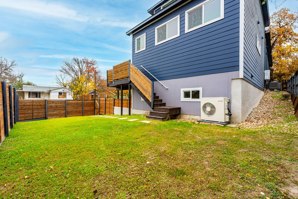 2016 Peoples Street Austin, TX 78702 - Photo 28 of 28 Back of property with a fenced backyard and stairway