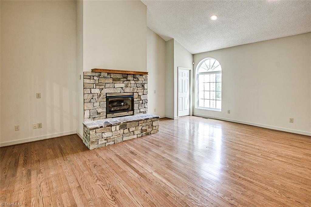 9015 Racine Road Pleasant Garden, NC 27313 - Photo 14 of 30 Den, stone fireplace w/gas logs