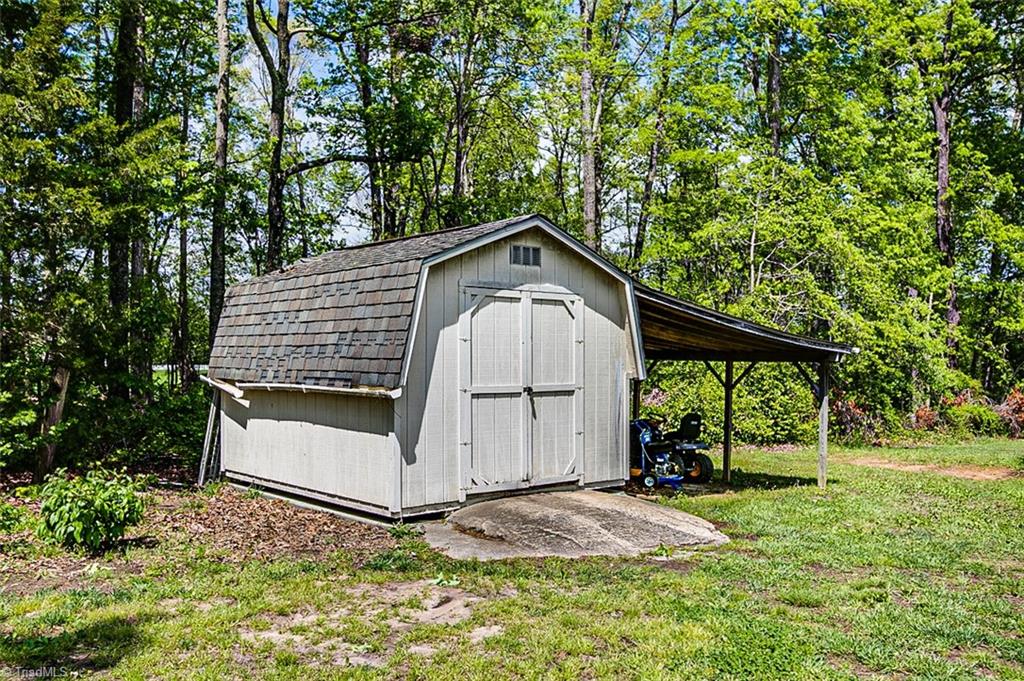 9015 Racine Road Pleasant Garden, NC 27313 - Photo 27 of 30 Storage building w/lean to shed
