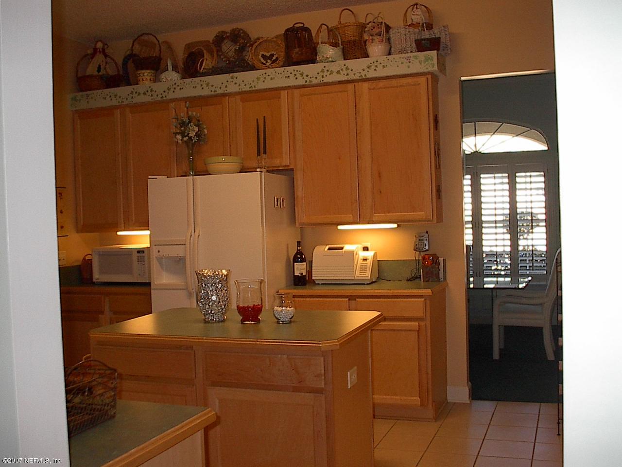 11382 Mandarin Ridge Lane Jacksonville, FL 32258 - Photo 11 of 23 a kitchen with a sink and cabinets