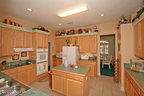 11382 Mandarin Ridge Lane Jacksonville, FL 32258 - Photo 12 of 23 a kitchen with a sink appliances and cabinets