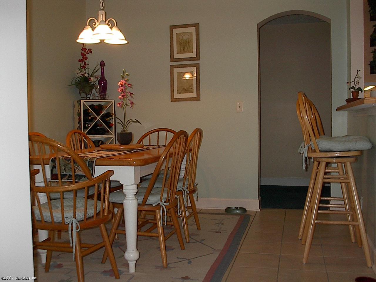 11382 Mandarin Ridge Lane Jacksonville, FL 32258 - Photo 15 of 23 a view of a dining room with furniture and wooden floor