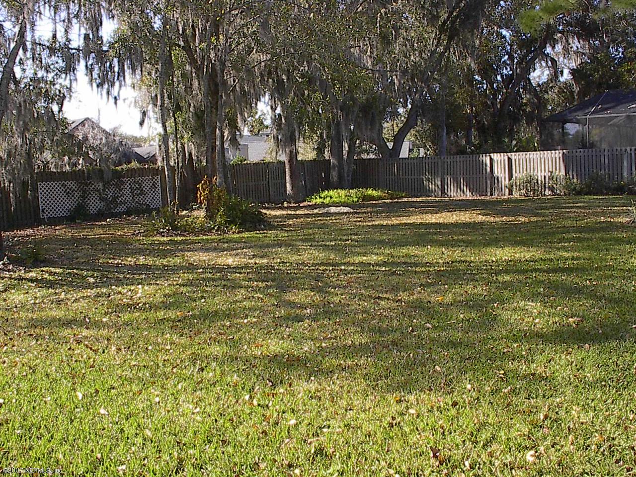 11382 Mandarin Ridge Lane Jacksonville, FL 32258 - Photo 22 of 23 a swimming pool with outdoor seating and yard