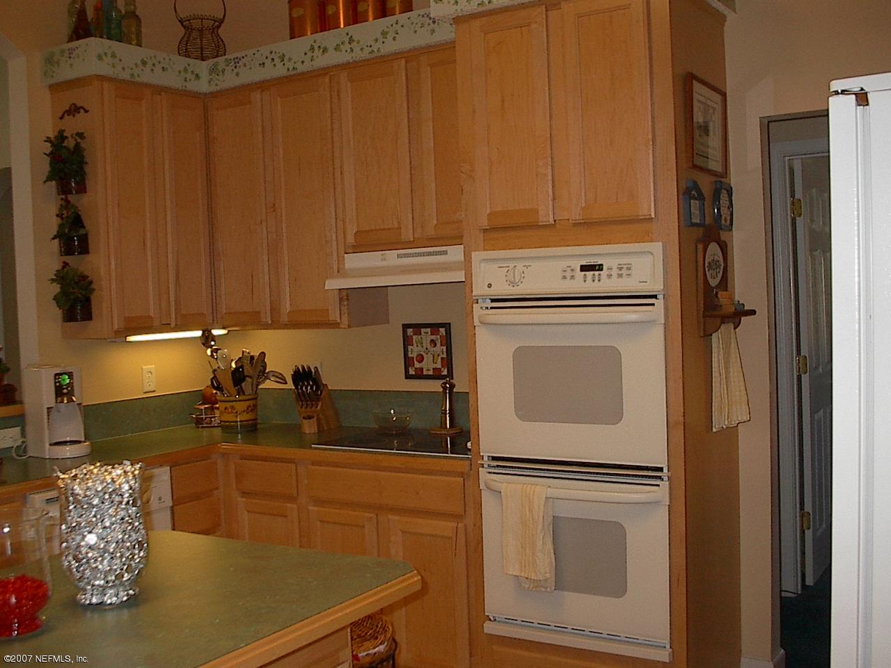 11382 Mandarin Ridge Lane Jacksonville, FL 32258 - Photo 9 of 23 a kitchen with cabinets appliances and a counter top space