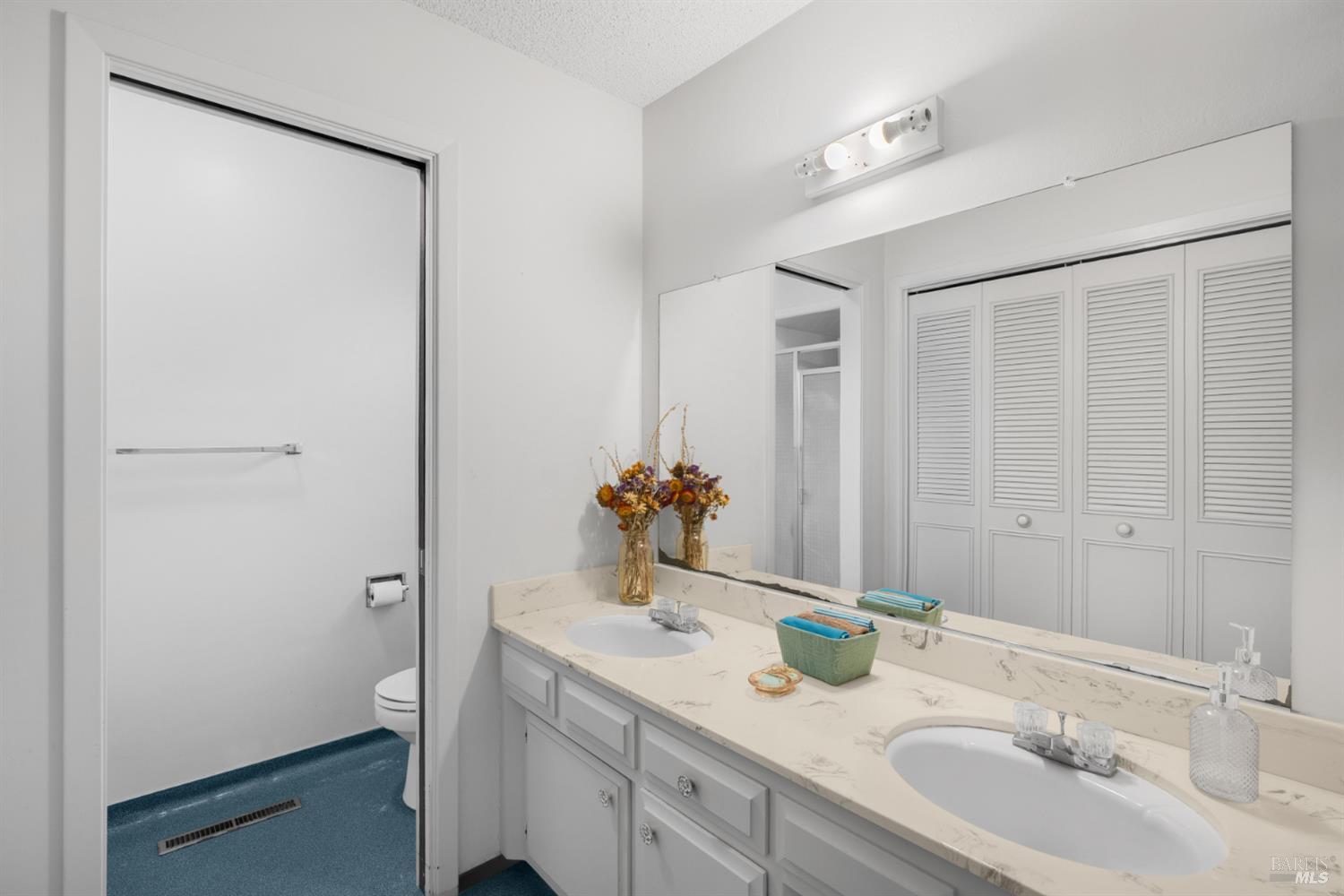 2904 Jason Drive Santa Rosa, CA 95405 - Photo 25 of 33 a bathroom with a double vanity sink and a mirror