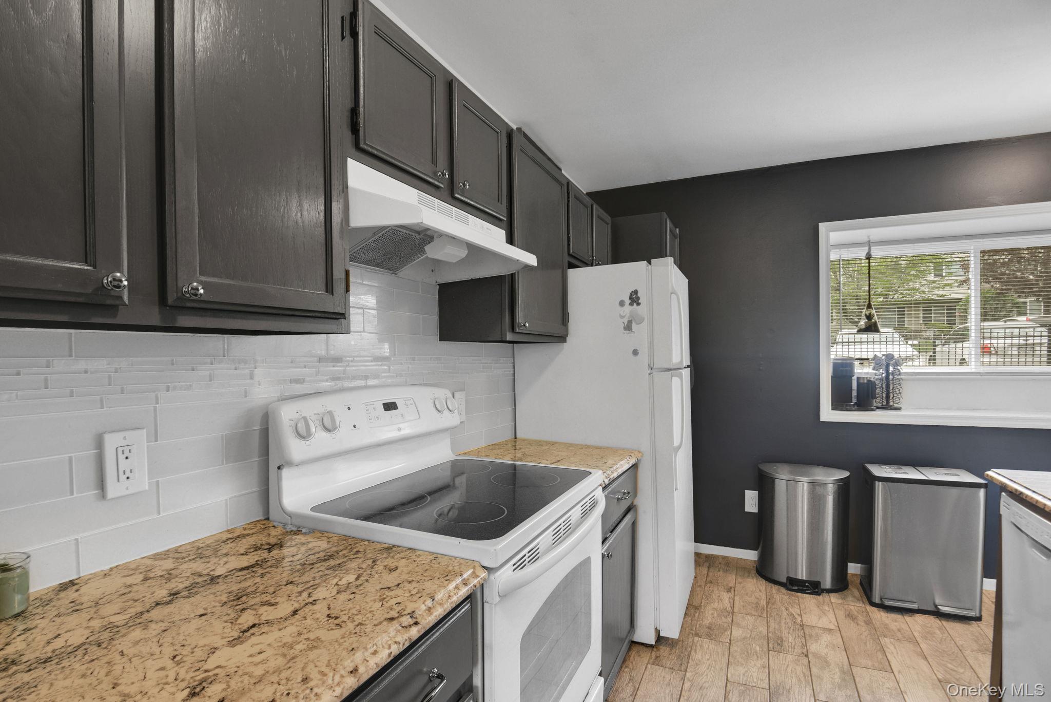 805 Eagles Ridge Road Brewster, NY 10509 - Photo 9 of 22 a kitchen with a stove and a refrigerator