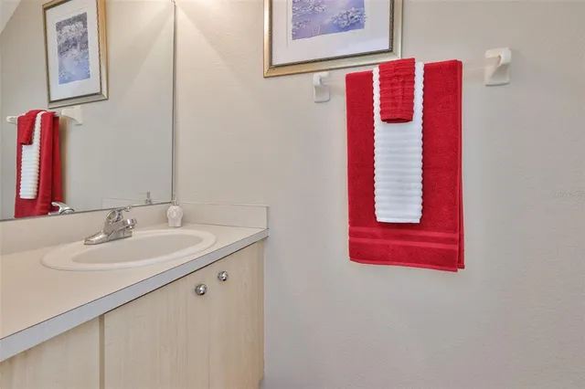 an aerial view of lake residential house with swimming pool and ocean view